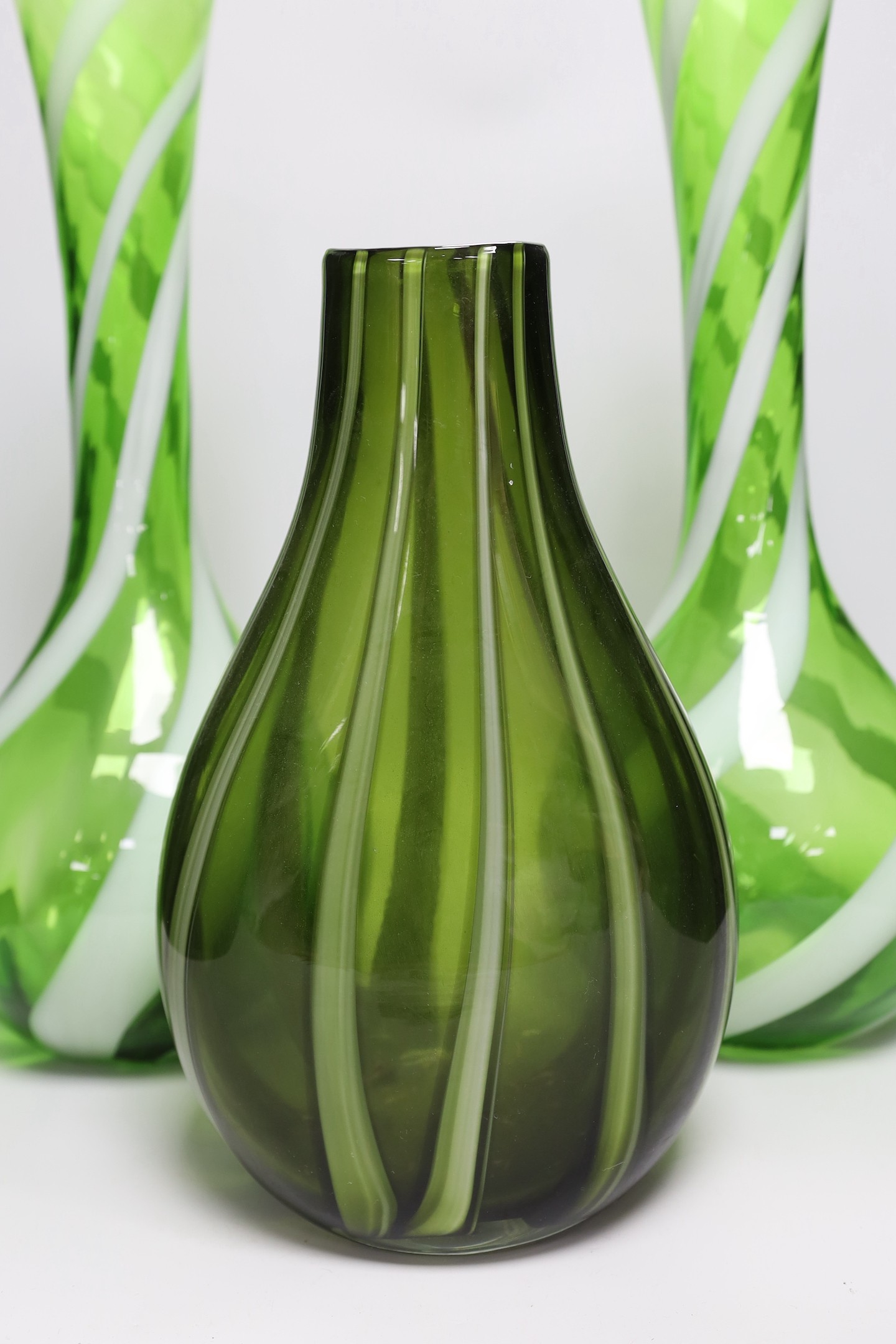 A pair of tall Murano green and white swirled glass vases and another Murano glass vase, tallest 50cm